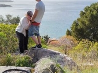 Spontaneous sex while hiking with a view over the city