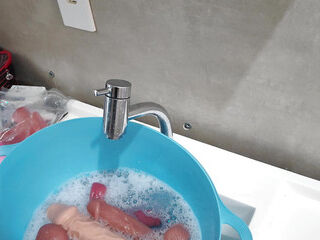 Camgirl showing everyday life, talking and cleaning toys