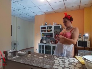 Nudist housekeeper Regina Noir cooking at the kitchen. Naked maid makes dumplings. part 1
