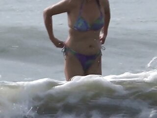 My mature wife shows off and enjoys the beach with her lover