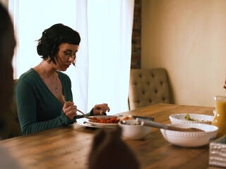 Dashing brunette spit-roasted by a pair of oversized black shafts