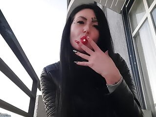 Smoking fetish from sexy Dominatrix Nika. Pretty woman blows cigarette smoke in your face