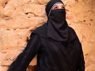 Arab very hot girl in a hijab smoking